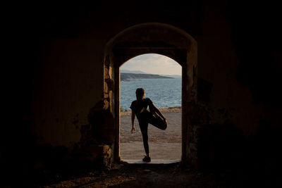 Silhouette man standing in sea