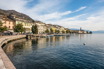 The beautiful lakeside of salò with the lake garda and the monte baldo in background