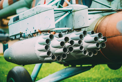 Close-up of machine part on field