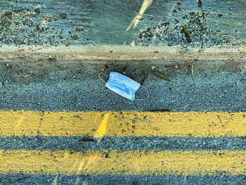 High angle view of arrow symbol on road