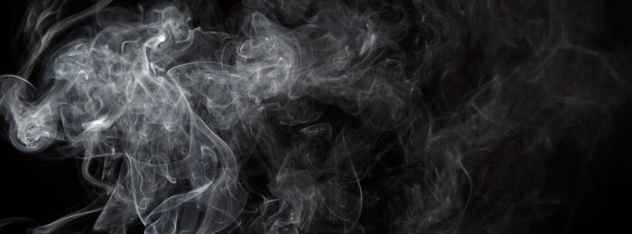 Close-up of smoke against black background