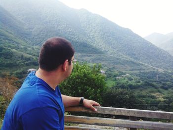 Man on landscape against mountains