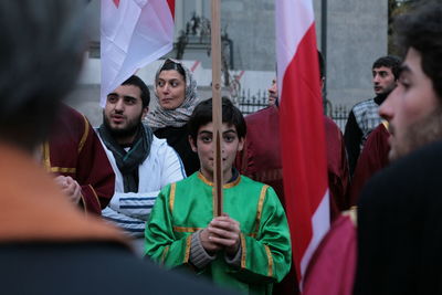 Group of people looking away outdoors