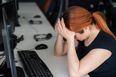 Young woman using laptop at home