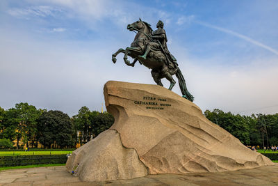 Low angle view of statue against sky