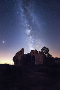 Low angle view of rock formation against sky