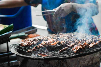 Close-up of meat on barbecue grill