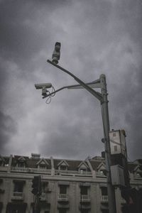 Low angle view of building against cloudy sky