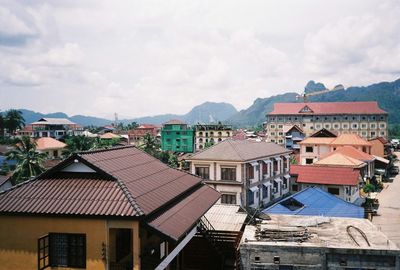 High angle view of buildings in town against sky