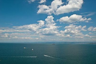 Scenic view of calm sea against cloudy sky