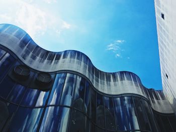 Low angle view of modern building against sky