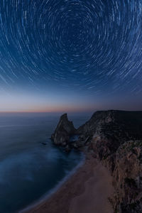 Scenic view of sea against sky at night