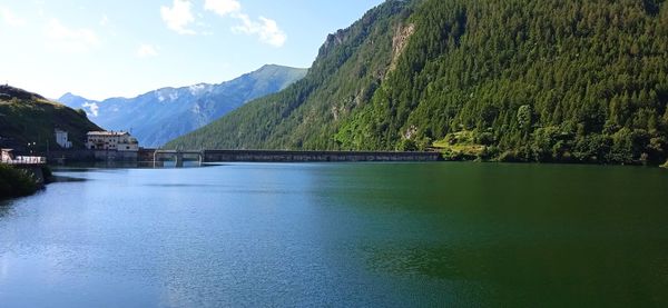 Scenic view of lake and mountains against sky