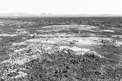 High angle view of land against clear sky