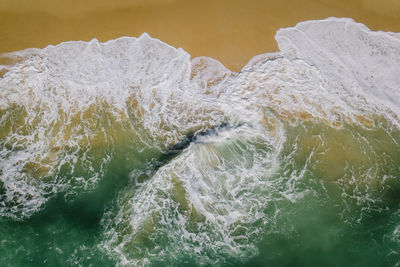 High angle view of water flowing in sea