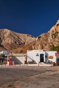 Scenic view of mountains against clear blue sky