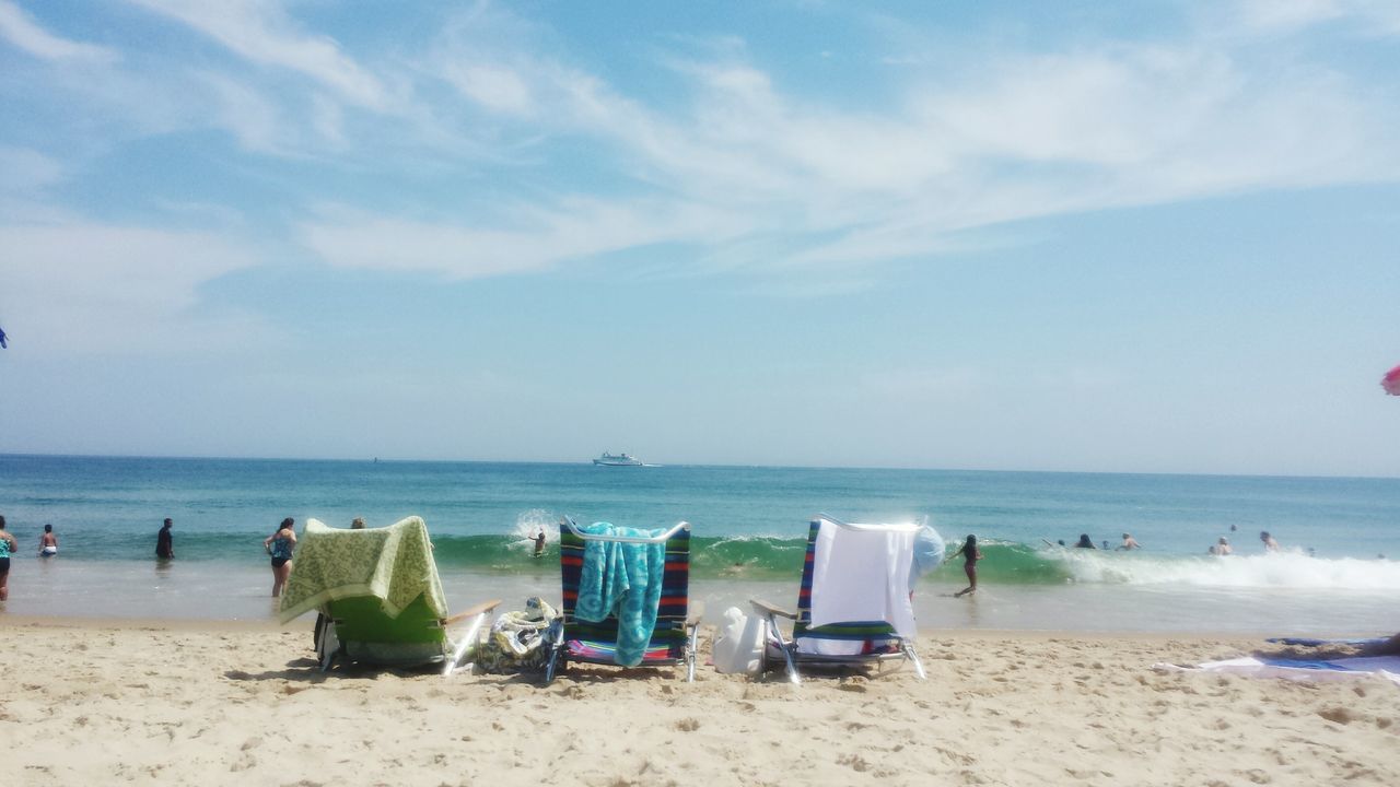 beach, sea, horizon over water, sand, shore, water, sky, tranquility, scenics, tranquil scene, beauty in nature, vacations, beach umbrella, blue, nature, summer, cloud - sky, cloud, idyllic, day