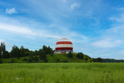 House on field against sky