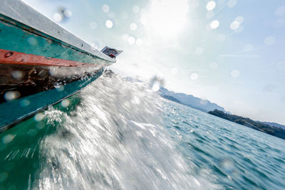 Boat sailing on sea against sky