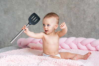 High angle view of cute baby boy eating food