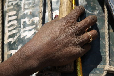 Cropped hand holding placard with message