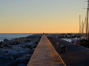 Scenic view of sea against clear sky during sunset