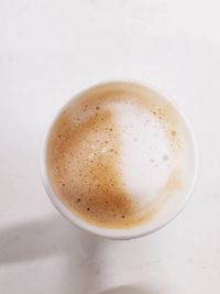 High angle view of cappuccino on table