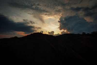 Scenic view of silhouette landscape against sky during sunset