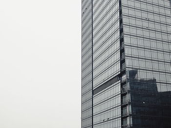 Low angle view of modern building against clear sky