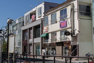 Low angle view of buildings against clear sky