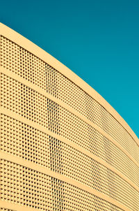 Low angle view of modern building against clear sky