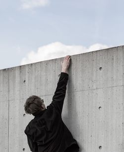 Man climbing wall