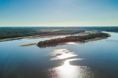 Aerial view of sea against clear sky