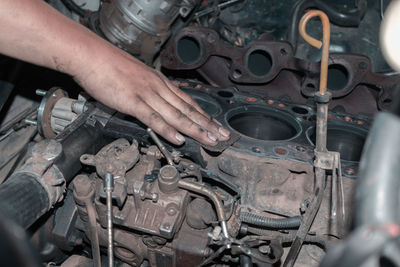 Cropped hand of man working in factory