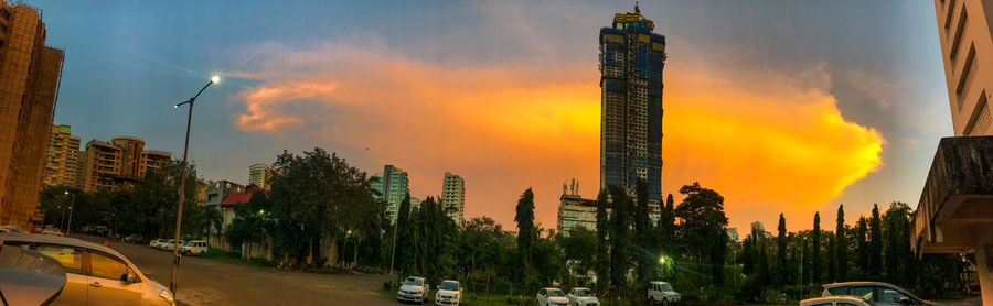 Panoramic view of city against sky during sunset