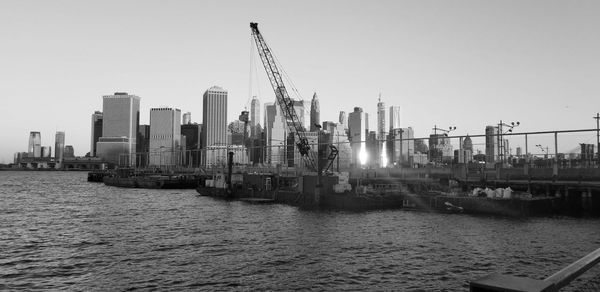 Panoramic view of river and buildings against clear sky