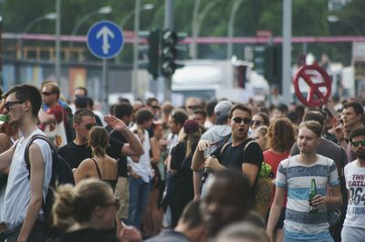 People looking at city street