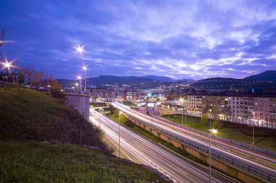 High angle view of light trails on road in city