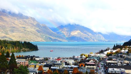 Panoramic shot of townscape by sea against sky