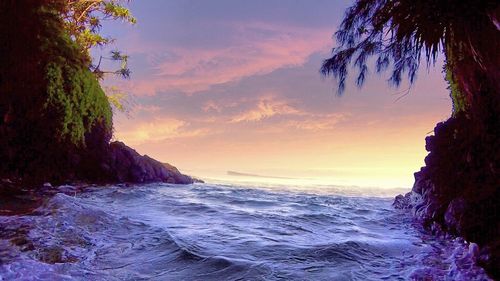 Scenic view of sea against sky at sunset