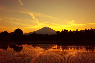 Scenic view of silhouette landscape against sky during sunset