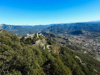 Scenic view of mountains against clear blue sky