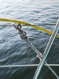 Close-up of rope tied on railing