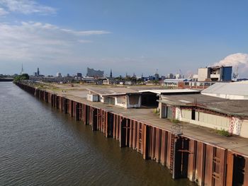 Bridge over river against sky and elbphilharmonie 