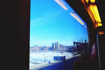 View of cityscape against blue sky