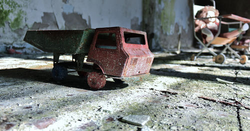 Close-up of old toy in abandoned house