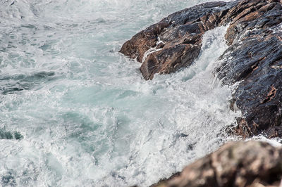 Sea waves splashing on rocks