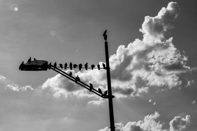 Low angle view of street light against sky