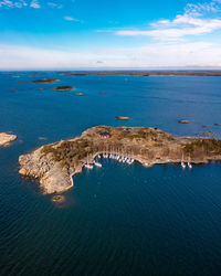 Small island with a sailboat harbor in finland