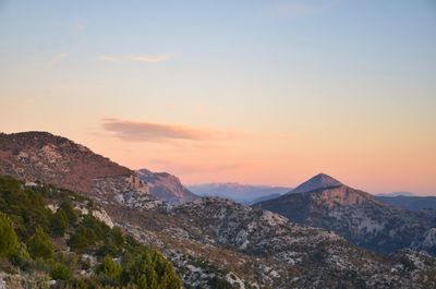 Scenic view of mountains against sky during sunset